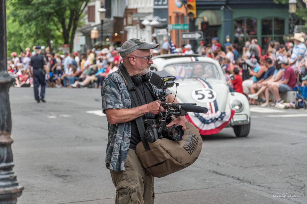 US-based video stringer covering a small town parade in Philadelphia area for a documentary crew